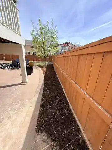 Fence and rock bed