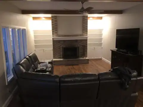 Living room with painted fireplace surround